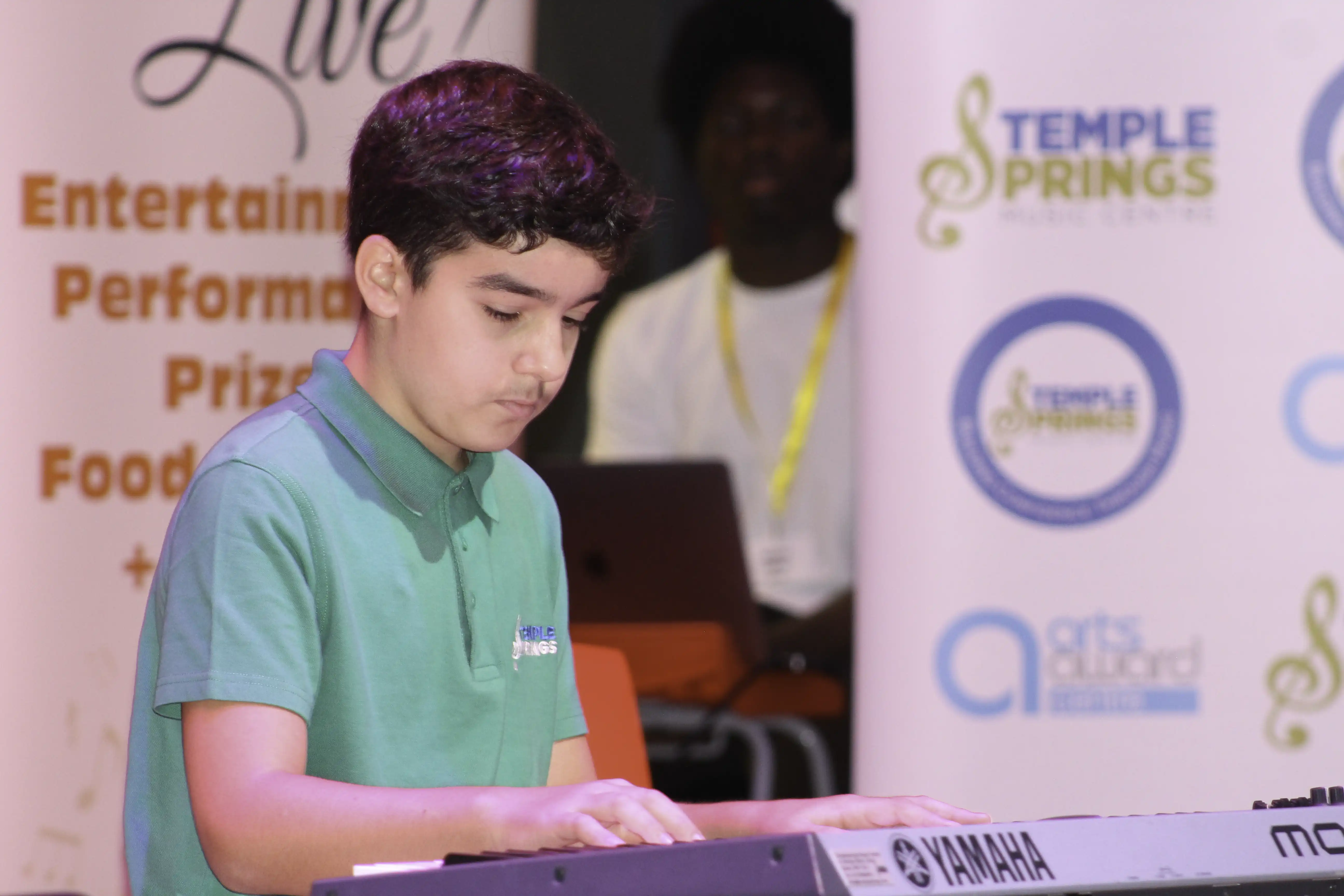 An image of one of our students playing at our Summer Music Slam, a concert in Grays.